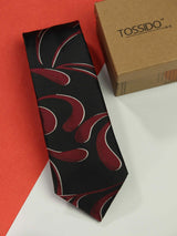 Black paisley necktie in woven microfiber, flat lay