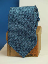 Blue abstract necktie in woven microfiber, close-up