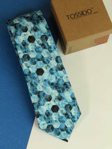 Blue geometric necktie in printed microfiber, close-up