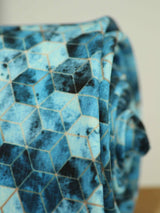 Blue geometric necktie in printed microfiber, tied view