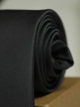 Dark Grey solid necktie in woven microfiber, flat lay