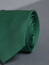 Green solid necktie in woven microfiber, flat lay