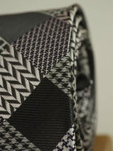 Grey check necktie in woven microfiber, tied view