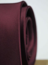 Maroon solid necktie in woven microfiber, tied view