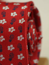 Red geometric necktie in woven microfiber, tied view
