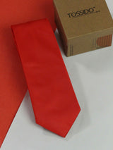 Red solid necktie in woven microfiber, flat lay