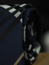 Blue check necktie in woven microfiber, tied view