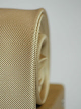 Beige solid necktie in woven microfiber, tied view