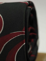 Black paisley necktie in woven microfiber, tied view