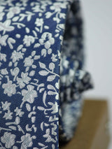 Blue floral necktie in woven microfiber, tied view