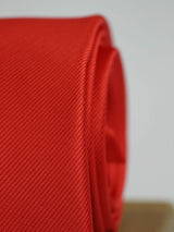 Bright Red solid necktie in woven microfiber, tied view