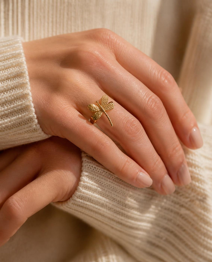 Gold ring worn on model's hand - Tossido jewellery
