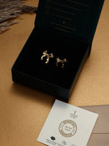 Gold Molten Bow Stud Earrings - TOSSIDO