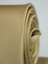 Gold solid necktie in woven microfiber, flat lay