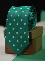 Green polka necktie in woven microfiber, flat lay