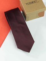 Maroon solid necktie in woven microfiber, close-up