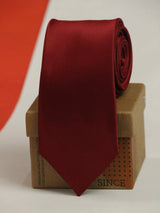 Maroon solid necktie in woven microfiber, close-up