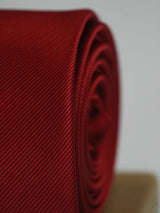 Maroon solid necktie in woven microfiber, tied view