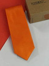 Orange solid necktie in woven microfiber, flat lay