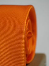 Orange solid necktie in woven microfiber, tied view