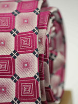 Pink geometric necktie in woven microfiber, tied view
