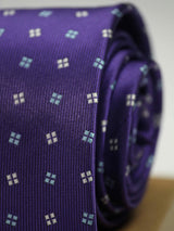 Purple geometric necktie in woven microfiber, tied view