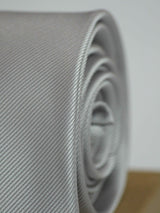 Silver solid necktie in woven microfiber, tied view