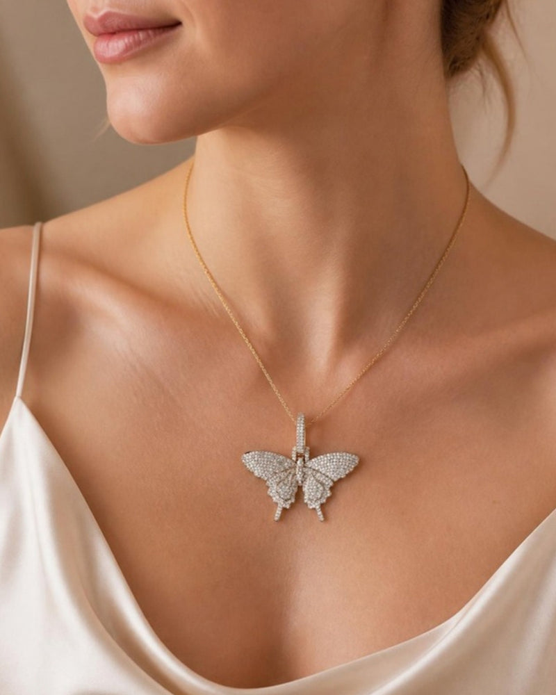 Gold pave butterfly pendant worn on model - Tossido jewellery