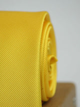 Yellow solid necktie in woven microfiber, tied view