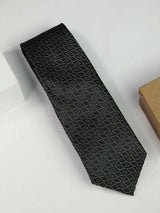 Black geometric necktie in woven microfiber, flat lay