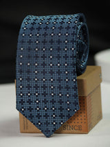 Blue geometric necktie in woven microfiber, close-up