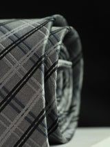 Grey check necktie in woven microfiber, tied view