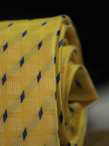 Yellow geometric necktie in woven microfiber, tied view